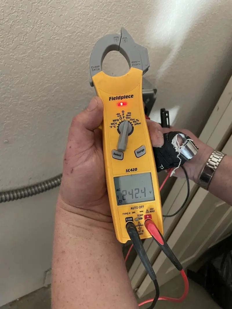 Voltage testing with clamp meter during Outlet Installation in Johnsburg